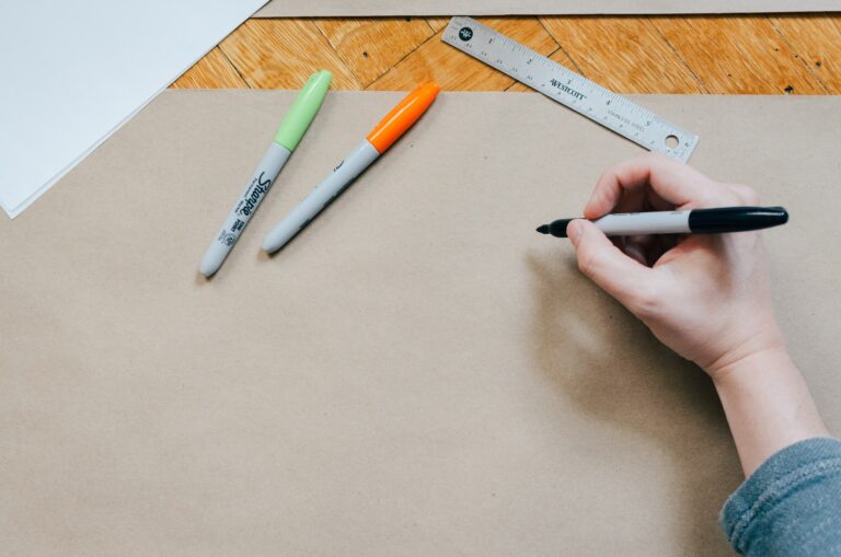 person holding black marker pen